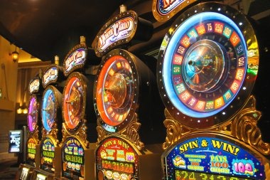 Ganesha Gold free spin feature with gold coin scatter symbols highlighted